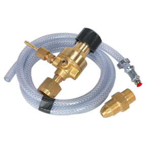 A clear flexible hose, similar to small-bore hosing, is attached to a brass valve assembly with a black knob and includes additional brass fittings and a small metal component with a red tip from the Sealey MIG Gas Regulator Kit No Gauge Regulator Industrial - REG/KIT/MZ.