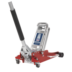 The Sealey Trolley Jack 1.5 Tonne Low Profile Aluminium Rocket Lift - RJA1550 is a red and silver hydraulic floor jack with a black handle and caster wheels, designed with a low profile lifting range and twin piston rocket lift for efficiently lifting vehicles.