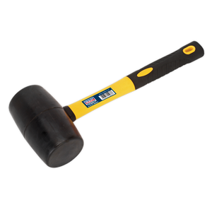 A black rubber mallet with a yellow and black handle, featuring a barcode sticker. This general-purpose Rubber Mallet 2lb with Fibreglass Shaft - RMB200 from Sealey boasts a durable fibreglass shaft for added strength.