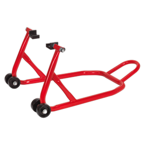 The Sealey Universal Rear Paddock Stand with Rubber Supports - RPS2 is a red motorbike stand equipped with four wheels and a handle, designed to lift the rear wheel of a motorcycle for maintenance and storage. It features adjustable rubber support pads for stability and dual swing arm compatibility.