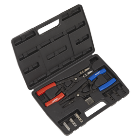 A Sealey Circlip Pliers Set Internal/External 265mm - S0553, featuring a black plastic toolbox filled with crimping tools with red and blue handles, various interchangeable dies, internal and external circlip pliers, and other components.