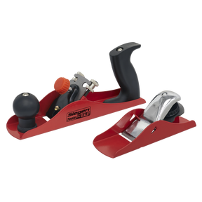 A pair of red and black hand planes from the "Sealey" brand, part of the Wood Planer Set 235mm & 163mm - S06092. The larger wood planer features a front knob and rear handle, while the smaller block plane has a simpler design.