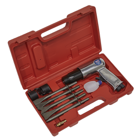 A red storage case containing the Sealey Air Hammer with Chisels Long Stroke - SA11, multiple chisel set attachments, a small oiler, and a brass fitting.