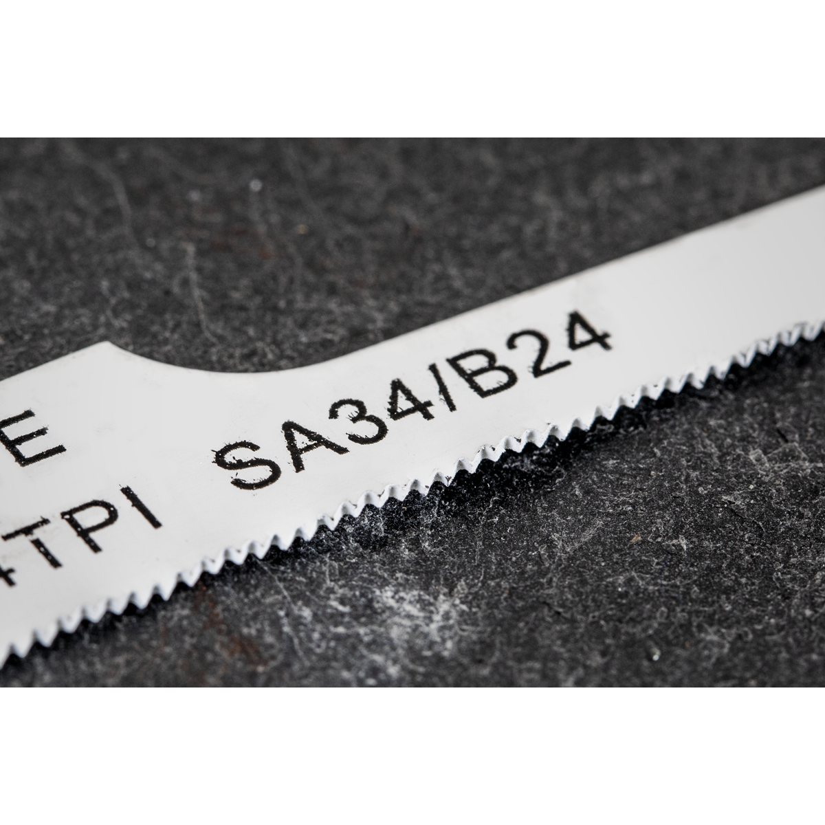 Close-up of a saw blade displaying text markings "SA34/B24" and "24 TPI" in black on a white background. This is part of the Sealey Air Saw Blade 24tpi Pack of 5, compatible with the Sealey air saw.