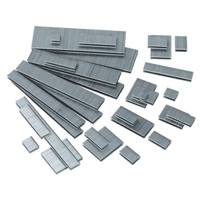 Assorted metal staples, including 18 gauge, scattered on a white background. Complete pack of 5000 for all your stapling needs - Staple 10mm 18SWG Pack of 5000 by Sealey (SAAS1810).