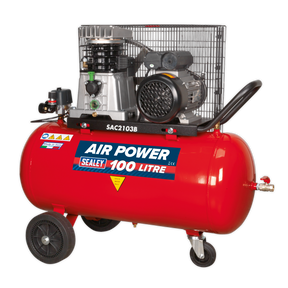 A Sealey Air Compressor 100L Belt Drive 3hp with Cast Cylinders & Wheels - SAC2103B, featuring a red body, black motor, cooling fan, and wheels for mobility, is perfect for a professional workshop.