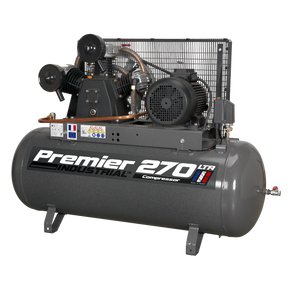 The Sealey Air Compressor 270L Belt Drive 7.5hp 3ph - SAC32775B, featuring a large cylindrical tank, multiple gauges, pipes, and motors, set against a plain background. This heavy-duty compressor includes a robust triple cylinder pump for enhanced performance.