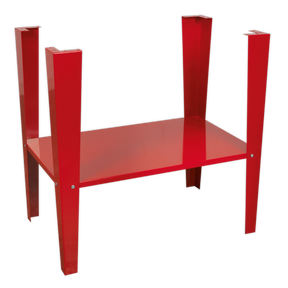 The Sealey Stand for SB972 - SB972/ST, a striking red metal table with angular legs, mirrors the sleek design of an inverted floor stand, evoking the presence of an art piece displayed in the corner of a shot blasting cabinet.