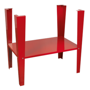 The Sealey Stand for SB972 - SB972/ST, a striking red metal table with angular legs, mirrors the sleek design of an inverted floor stand, evoking the presence of an art piece displayed in the corner of a shot blasting cabinet.