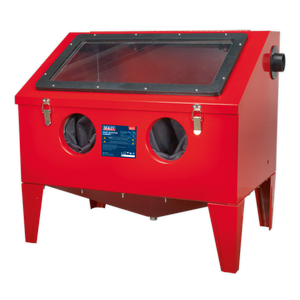 The Shot Blasting Cabinet 760 x 510 x 715mm - SB972 from Sealey features a red benchtop design with a front viewing window, two glove ports, and a black knob on the side. The steel cabinet is supported by four elevated legs and has a manufacturer's label on the front, making it ideal for workshop cleaning applications.