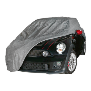 A black car partially covered with the Sealey All Seasons Car Cover 3-Layer - Small - SCCS, exposing its front, headlights, and red side mirrors. This professional car cover features waterproof 3-layer material and provides excellent UV/heat protection.