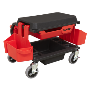 The Sealey Mechanic's Detailing Utility Seat Deluxe - SCR90 is a red and black rolling tool cart featuring multiple storage compartments and a detachable seat with extra-thick cushioned padding. Equipped with sturdy wheels for easy mobility, this cart is perfect for any workspace.