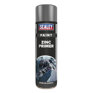 A cylindrical spray can labeled "Sealey Grey Zinc Primer Paint 500ml - SCS034S" with an image of gloved hands using the fast-drying, anti-rust spray on its front.