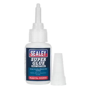 A bottle of Sealey Super Glue Fast Setting 20g - SCS302S with accompanying cap. The label indicates it is a fast-setting, low viscosity adhesive ideal for difficult surfaces and low humidity. Perfectly suited for bonding metal applications, this product ensures reliable performance every time.