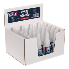 A display box containing 20 bottles of Sealey Super Glue Fast Setting 20g (SCS302), each labeled as a fast-setting adhesive. The box showcases product information on the front and highlights its ability to bond metal.