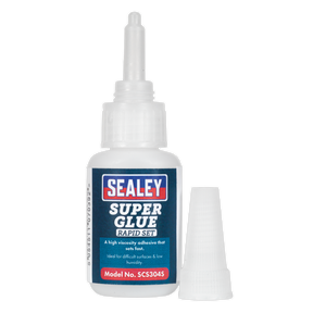 A bottle of Sealey Super Glue Rapid Set 20g - SCS304S with its cap removed and placed beside it. The label describes it as a high viscosity adhesive that sets fast, ideal for bonding metal, rubber, plastics, and wood on difficult surfaces and in low humidity.