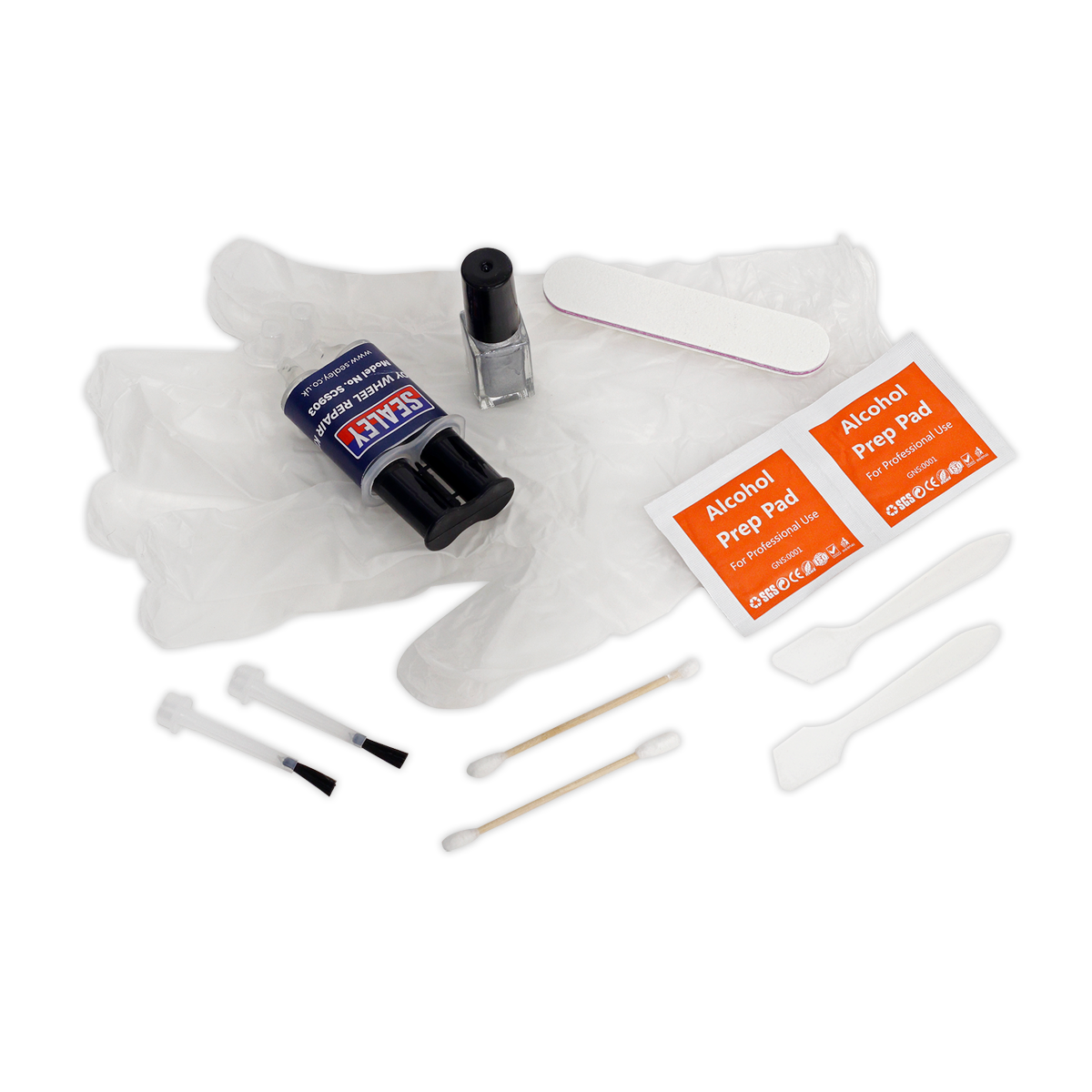 The Alloy Wheel Repair Kit - SCS903 by Sealey includes rubber gloves, two alcohol prep pads, a cleaning brush, small tools, a nail polish bottle, a nail file, and a roll of nail tape to ensure precision akin to curb damage repair.