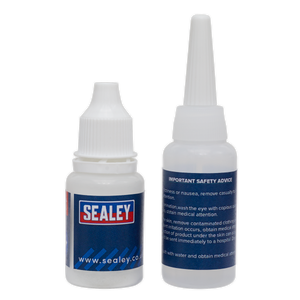 Two Sealey Fast-Fix Filler & Adhesive - Clear - SCS906 bottles, one front-facing showing the label and one back-facing displaying safety advice. Both bottles have white caps and are part of a repair system known for its rapid solidification properties.