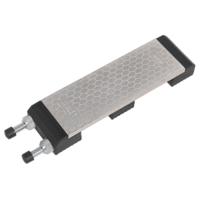 The Sealey Combination Diamond Sharpening Whetstone with Adjustable Stone Holder - SCSS1 is a rectangular diamond whetstone with a textured surface, featuring two adjustable clamps on either end. It's perfect for sharpening knives, offering 400 and 1000 grit options.