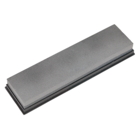 The Sealey Combination Sharpening Stone - SCSS2 is a rectangular silicone carbide stone with a gray surface and a darker base, offering both fine and medium grades. It comes neatly packaged in a durable plastic box.