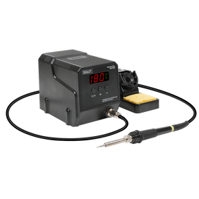 The Sealey Soldering Station 60W - SD006 features MCU controlled temperature calibration and a digital display reading 180°C. It includes a soldering iron connected by a cable and a sponge holder, ensuring rapid heat-up for efficient work.