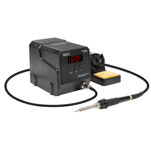 The Sealey Soldering Station 60W - SD006 features MCU controlled temperature calibration and a digital display reading 180°C. It includes a soldering iron connected by a cable and a sponge holder, ensuring rapid heat-up for efficient work.