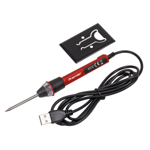 The USB Soldering Iron 8W - SDL12 by Sealey, with a red body and black handle, is perfect for hobbyists soldering or welding circuit boards. It features a long power cord ending in a USB plug and includes a black stand, making it ideal for enthusiasts using Premier Hand Tools.