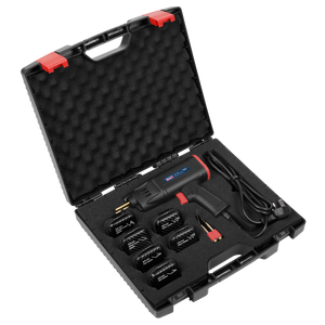 The Sealey Plastic Welding Repair Kit 75W - SDL15 comes in a black carrying case, which features foam cutouts that neatly arrange the included pistol grip design heat gun, five nozzle attachments, power cord, and metal scraper tool. Ideal for plastic repair projects, this case is equipped with a handle and red latches for secure transport.