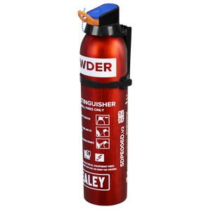 A compact 0.6kg red powder fire extinguisher, model SDPE006D by Sealey, featuring a blue safety pin and various labels, including usage instructions for B and C class fires.