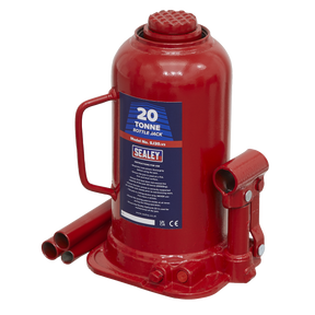 The Sealey Bottle Jack 20 Tonne - SJ20 features a machine-welded frame, a carrying handle for easy transport, and a label displaying specifications, all in a striking red color.