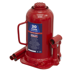 The Sealey Bottle Jack 20 Tonne - SJ20 features a machine-welded frame, a carrying handle for easy transport, and a label displaying specifications, all in a striking red color.