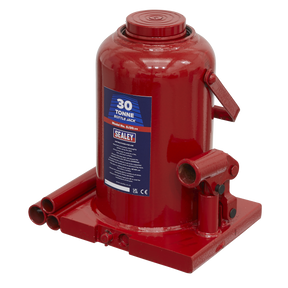 The Sealey Bottle Jack 30 Tonne - SJ30, featuring a red body with clear labeling, a sturdy carrying handle, and a well-designed base and reservoir, is perfect for lifting heavy objects.