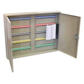 The Sealey Key Cabinet 100 Key Capacity Wide (SKC100W) is a metallic cabinet with an open door, revealing multiple rows of colored key tags and a clipboard with paper attached to the interior of the door, showcasing its steel construction for added durability.