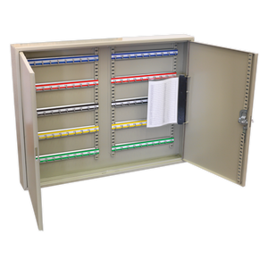 The Sealey Key Cabinet 100 Key Capacity Wide (SKC100W) is a metallic cabinet with an open door, revealing multiple rows of colored key tags and a clipboard with paper attached to the interior of the door, showcasing its steel construction for added durability.