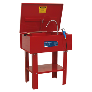 The Sealey SM22 Parts Cleaning Tank Air Operated is designed for hazardous environments, ensuring durability and safety for tough cleaning jobs. This heavy-duty red parts washer features an open lid with a warning label inside, a flexible nozzle, and a cleaning brush. The welded steel tank stands on four sturdy legs with a lower shelf for added convenience.