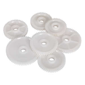 Several white plastic gears of varying sizes, resembling the high-quality Sealey Thread Cutting Gear Kit Metric - SM2503TCK for a mini lathe, are arranged in a cluster on a plain background.