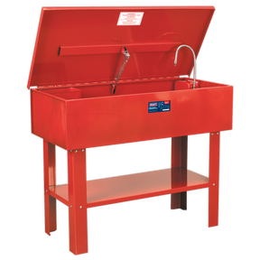 The Sealey Parts Cleaning Tank - SM40 is a red metal washer featuring an open lid, a cleaning nozzle, and a front label. It boasts a large capacity tank and is supported by four sturdy legs. This washer also comes with a triple-baked enamel finish for enhanced durability.