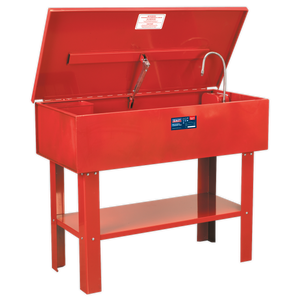 The Sealey Parts Cleaning Tank - SM40 is a red metal washer featuring an open lid, a cleaning nozzle, and a front label. It boasts a large capacity tank and is supported by four sturdy legs. This washer also comes with a triple-baked enamel finish for enhanced durability.