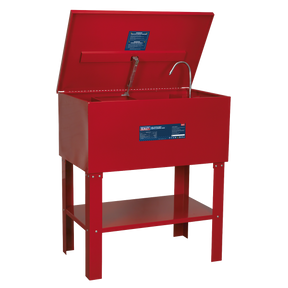 The Sealey Parts Cleaning Tank Extra-Deep 136L - SM40D, in red, features a heavy-duty steel tank with an open lid, a flexible metal nozzle, and a lower storage shelf on four sturdy legs.