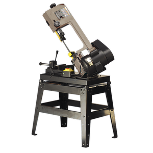 The Sealey Metal Cutting Bandsaw 150mm 230V with Mitre & Quick Lock Vice - SM65 is mounted on a sturdy black stand and features a beige-colored body. It comes equipped with an oil-bath gearbox, adjustable precision blade guides, and multiple safety features that comply with the Machinery Safety Directive.