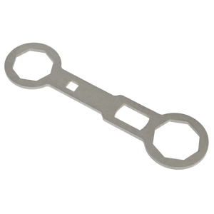 Sealey's Fork Cap Spanner 46 & 50mm - SMC46 is a metal wrench-like tool with two hexagonal openings of different sizes on each end and a rectangular opening in the middle, resembling the Showa fork cap spanner.