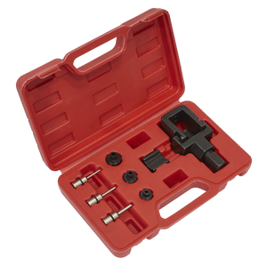 A red plastic carrying case containing the Sealey Motorcycle Chain Splitter & Riveting Tool Set - Heavy-Duty (Model: SMC4), designed for motorcycle chains and various metal components and attachments.