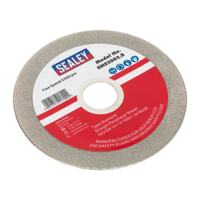 A Sealey branded Grinding Disc Diamond Coated 100mm with a red and white label indicating Model No. SMS2003.B, featuring a free speed of 5300rpm and safety instructions. Ideal for pairing with a saw blade sharpener to maintain its cutting precision.