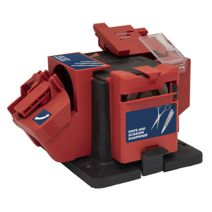 A red and black, portable Sealey electric multipurpose sharpener, model SMS2004 with a 65W motor and convenient bench mounting feature, equipped with various slots for knives and scissors and labeled with instructional stickers.