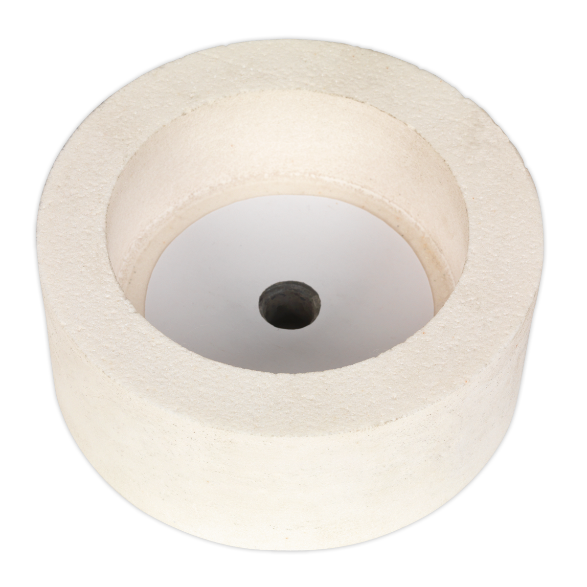 A cylindrical white object with a central hole, resembling a thick washer or spool, lies on a flat surface, much like the Dry Stone Wheel Ø125mm for SMS2107 (SMS2107GW125D) by Sealey.