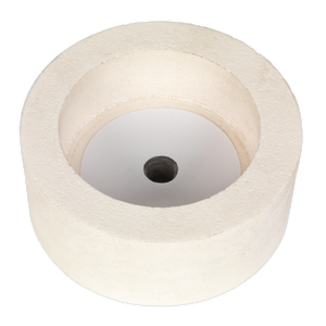 A cylindrical white object with a central hole, resembling a thick washer or spool, lies on a flat surface, much like the Dry Stone Wheel Ø125mm for SMS2107 (SMS2107GW125D) by Sealey.