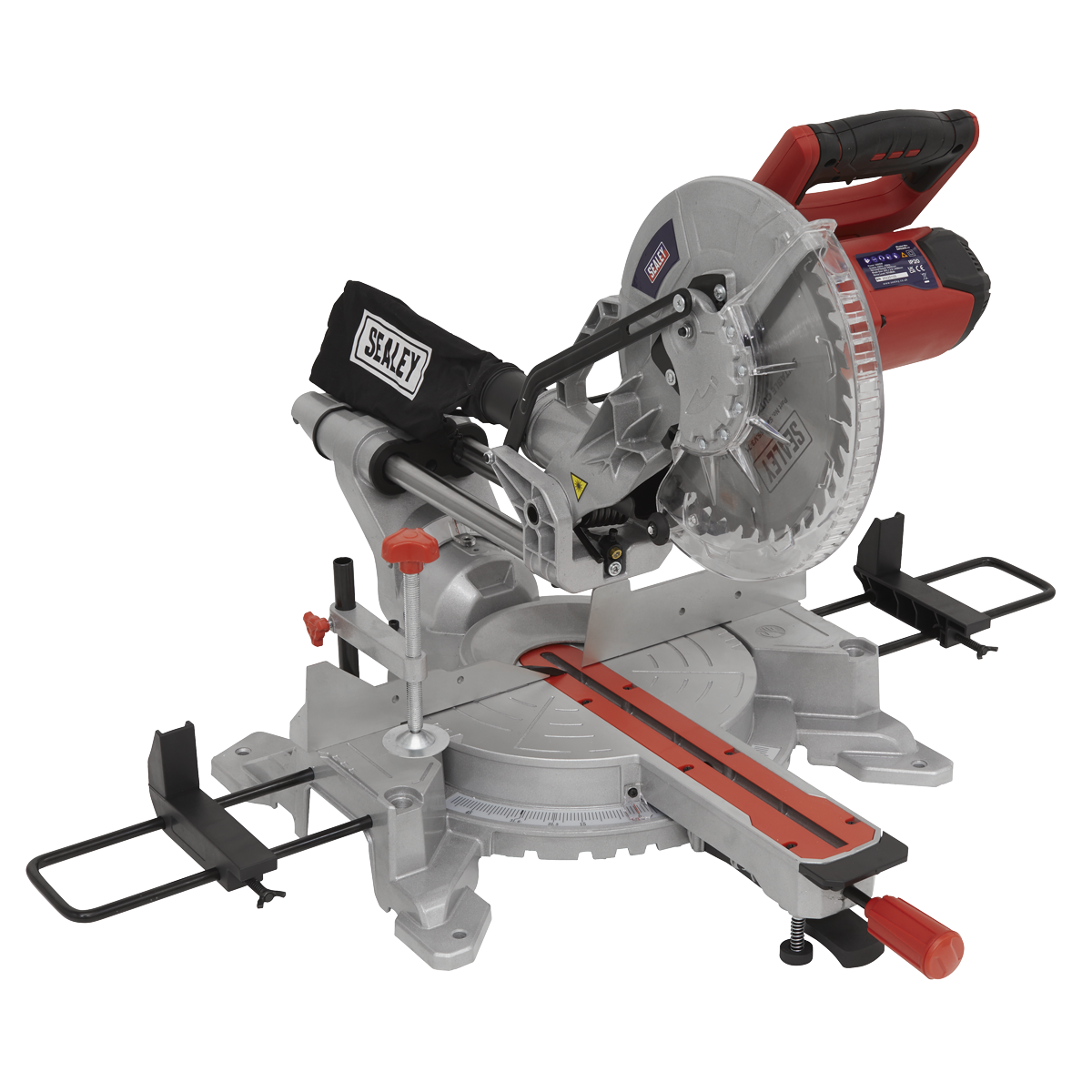 Introducing the Sealey Sliding Compound Mitre Saw Ø255mm - SMS255. This miter saw is mounted on a sturdy base and features a sleek silver body with striking red accents and a comfortable black handle. It comes equipped with a circular multipurpose blade for versatile cutting tasks, and the attached black dust collection bag prominently displays the "Sealey" logo. Powered by an impressive 2000W motor, this saw ensures efficient and precise cutting every time.