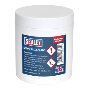 A white plastic tub labeled "Sealey Flux Paste 250g - SOL250" features safety warnings, product information, and a UK flag on the front.