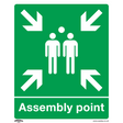 The Sealey Safe Conditions Safety Sign - Assembly Point (SS37P10), crafted from rigid plastic, features a green background with white figures and four inward-pointing arrows. The text "Assembly point" is written underneath, making it ideal for commercial environments such as offices or workshops. Available in a pack of 10.