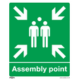 Sealey's Safe Conditions Safety Sign - Assembly Point (SS37P1) is made of rigid plastic and features white arrows pointing inward at three standing figures in the center, designating a gathering area. This green sign is ideal for commercial environments such as offices.